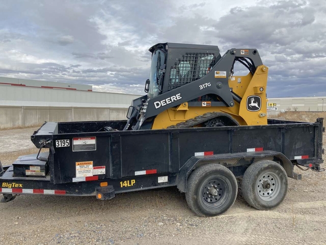 Equipment trailer with a front loader